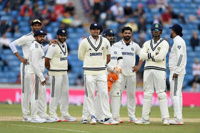 Indian team strategizes during a break in play.