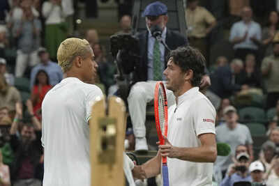 Taylor Fritz and Gabriel Diallo shake hands at Wimbledon 2025