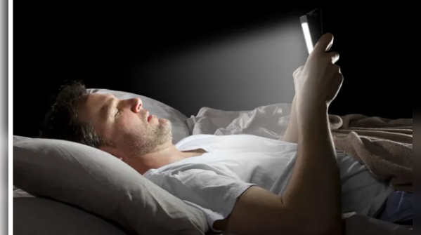 Electronic devices emitting blue light near the bed