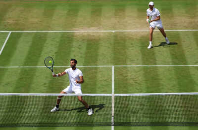 Yuki Bhambri plays a forehand at Wimbledon 2025