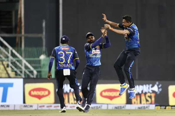 Sri Lankan fielders celebrate a crucial wicket.